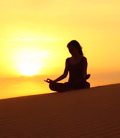 Yoga in desert camp in morocco